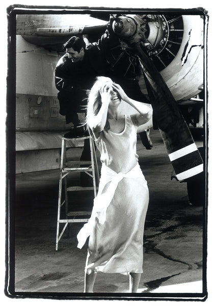 Girl Standing by Aircraft Engine