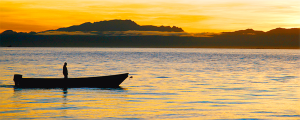 Sunrise Man in Boat